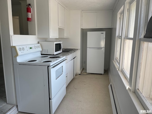 kitchen with white cabinetry, white appliances, and a textured ceiling