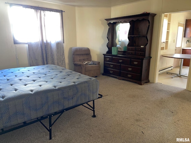 bedroom featuring a baseboard radiator, connected bathroom, and light colored carpet