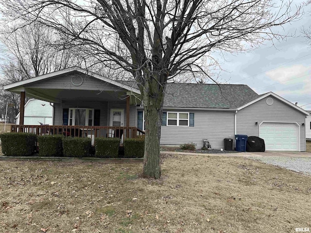 single story home featuring a garage and covered porch