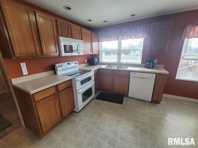 kitchen featuring sink and white appliances