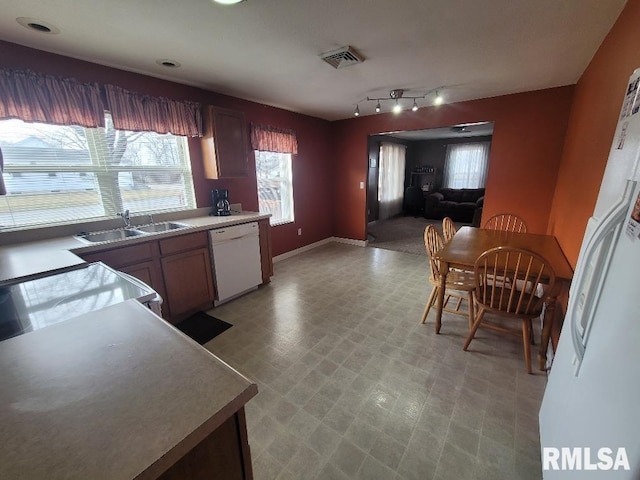 kitchen with sink and white appliances