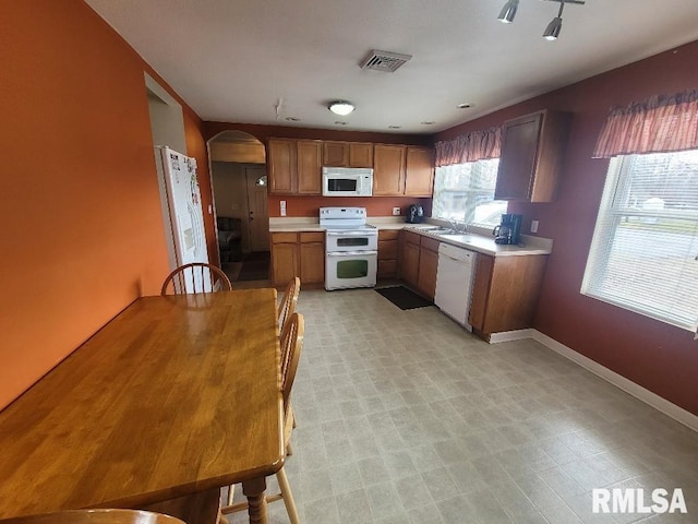 kitchen featuring sink and white appliances