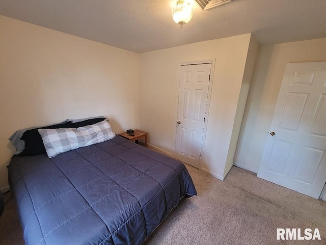 bedroom featuring carpet