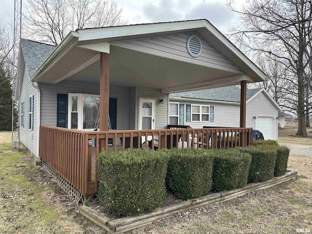 view of front of property featuring a garage and a porch