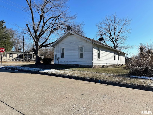 view of home's exterior featuring a carport