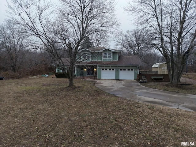 front facade with a garage and a front yard