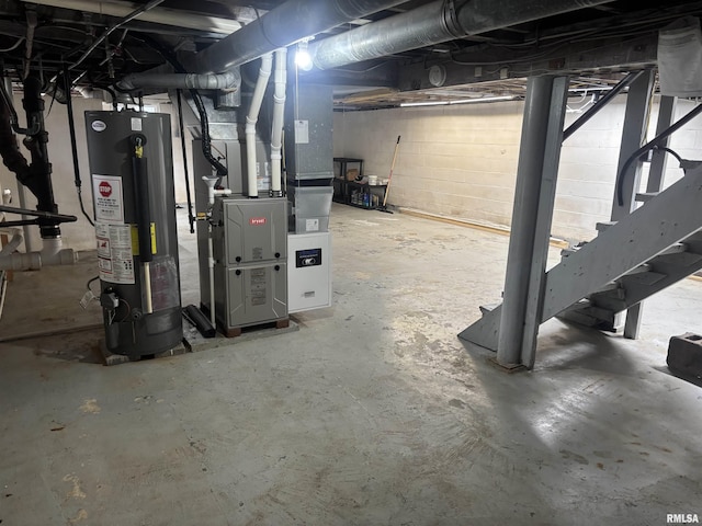 basement featuring gas water heater and heating unit