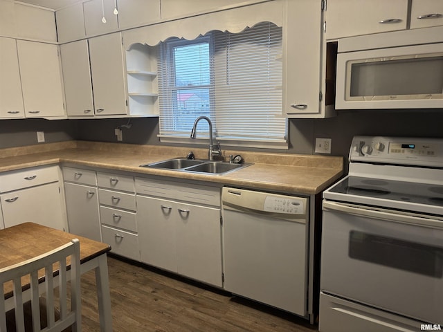 kitchen featuring dark hardwood / wood-style flooring, sink, white cabinets, and white appliances