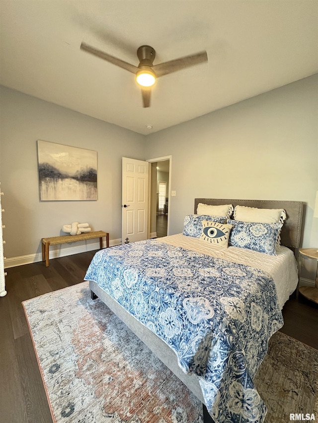 bedroom featuring dark hardwood / wood-style flooring and ceiling fan