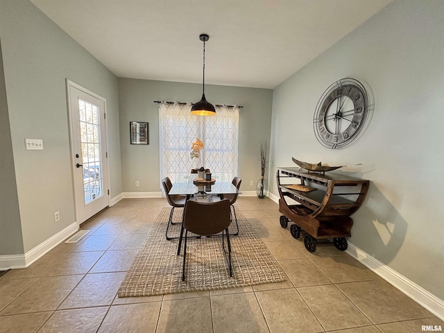 dining space featuring tile patterned flooring