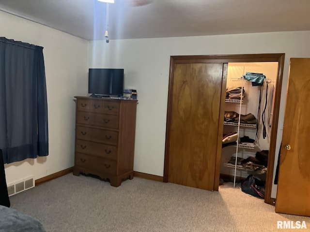 carpeted bedroom featuring a closet