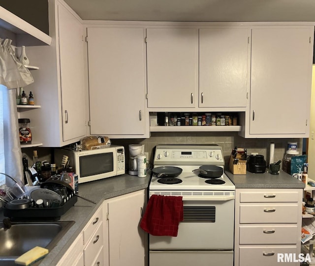 kitchen featuring sink, white cabinets, white appliances, and decorative backsplash