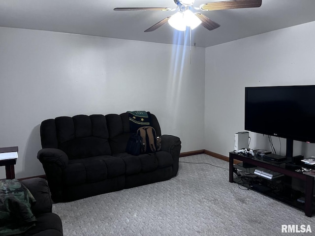 carpeted living room featuring ceiling fan