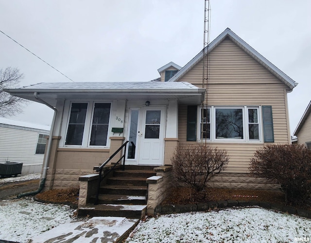 bungalow-style home featuring central AC unit