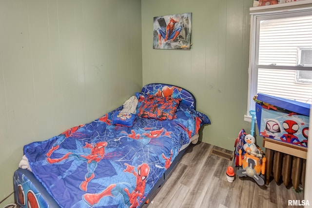 bedroom featuring hardwood / wood-style flooring