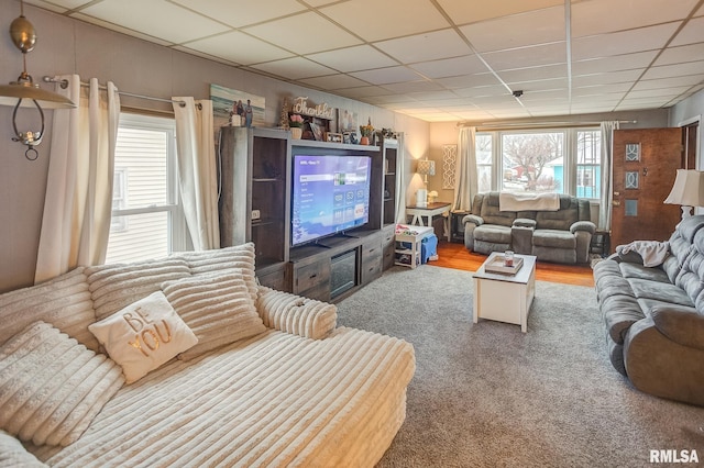 living room featuring a paneled ceiling