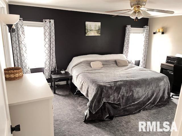 carpeted bedroom with ceiling fan