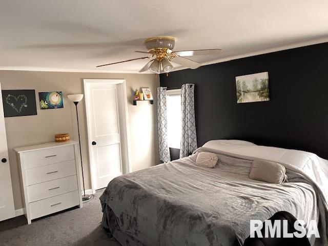 carpeted bedroom with ceiling fan