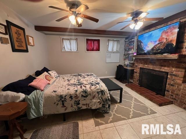 bedroom featuring light tile patterned floors, a fireplace, and ceiling fan