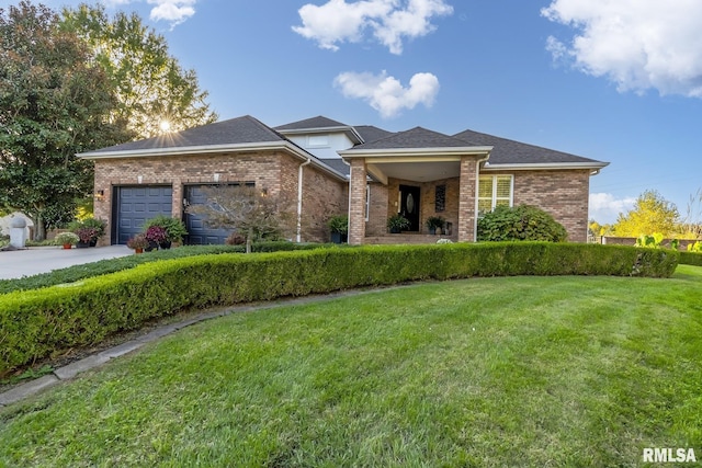 view of front of home with a garage and a front yard