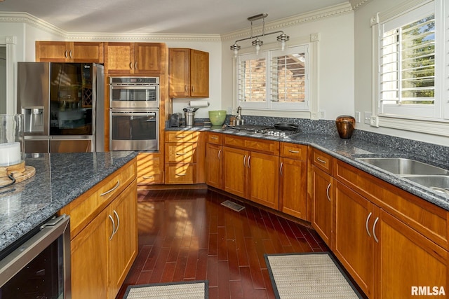 kitchen with wine cooler, sink, crown molding, dark stone countertops, and appliances with stainless steel finishes