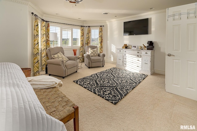 sitting room with ornamental molding and light carpet