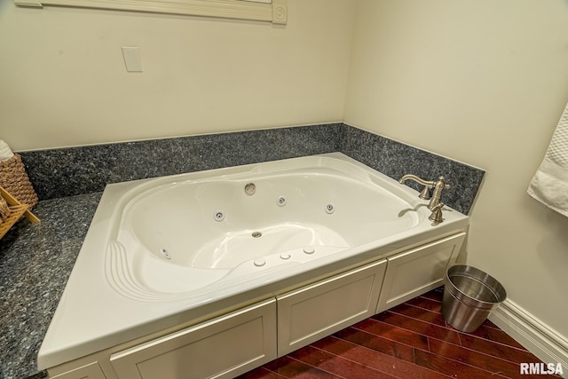 bathroom featuring a tub to relax in