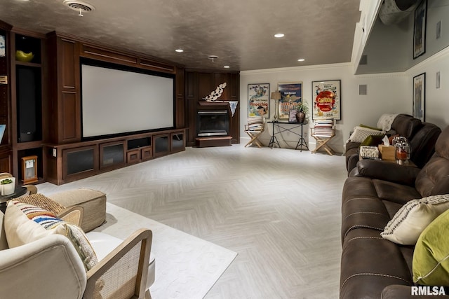 home theater room featuring crown molding and light parquet flooring
