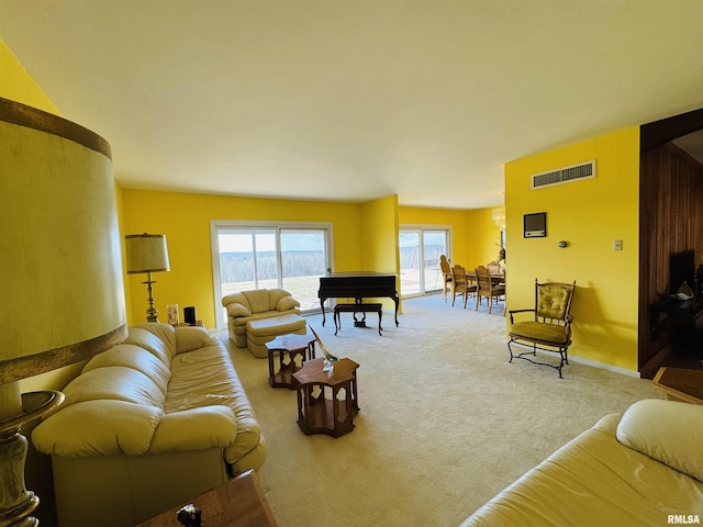 carpeted living room with visible vents