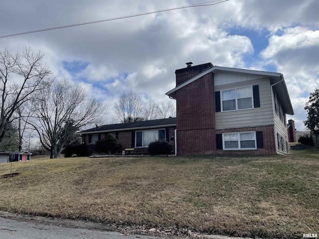 tri-level home with a front yard