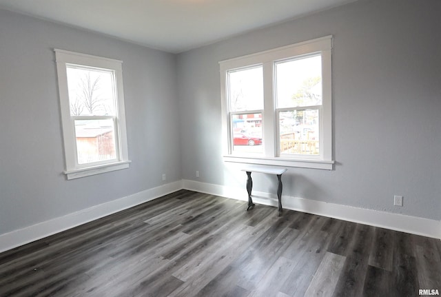 empty room featuring dark hardwood / wood-style flooring