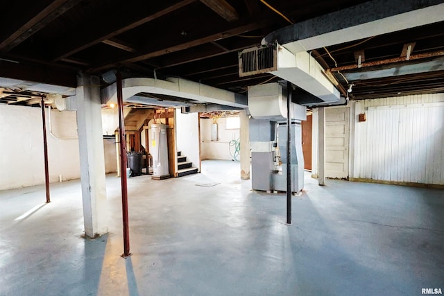 basement with water heater and heating unit