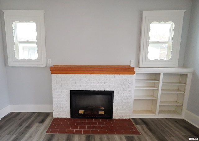 room details with a brick fireplace and hardwood / wood-style flooring