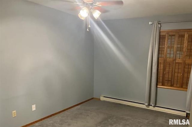 empty room with dark carpet, a baseboard radiator, and ceiling fan