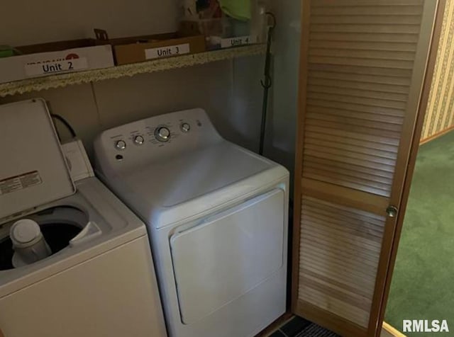 washroom with washer and dryer