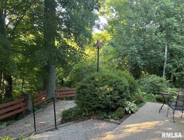 surrounding community featuring a patio