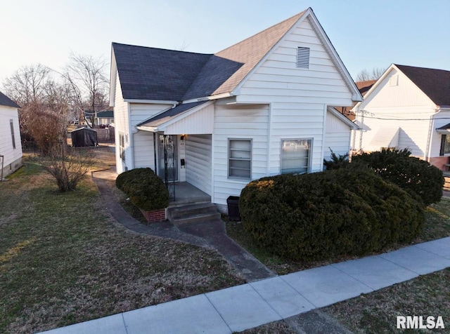 bungalow-style home featuring a front yard