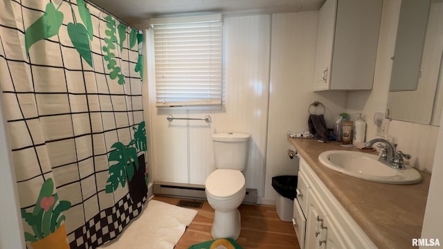 bathroom featuring vanity, wood-type flooring, toilet, and baseboard heating