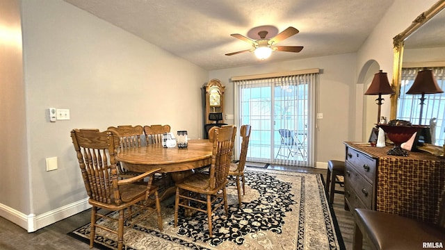 dining room featuring dark hardwood / wood-style floors and ceiling fan