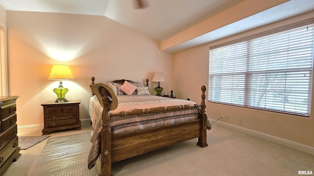 carpeted bedroom featuring vaulted ceiling