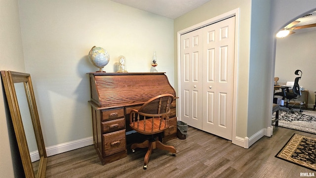 office with dark hardwood / wood-style flooring