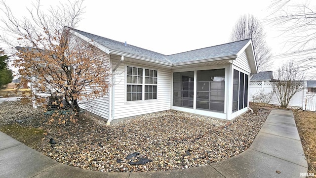 view of home's exterior featuring a sunroom