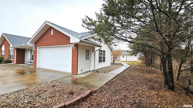 view of side of property with a garage