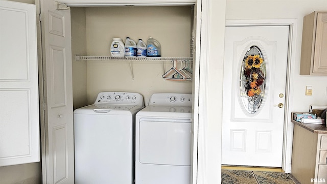 laundry area featuring washing machine and clothes dryer