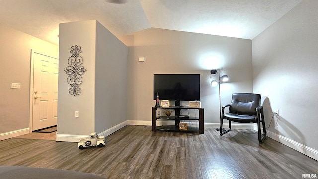 sitting room with lofted ceiling and dark hardwood / wood-style floors