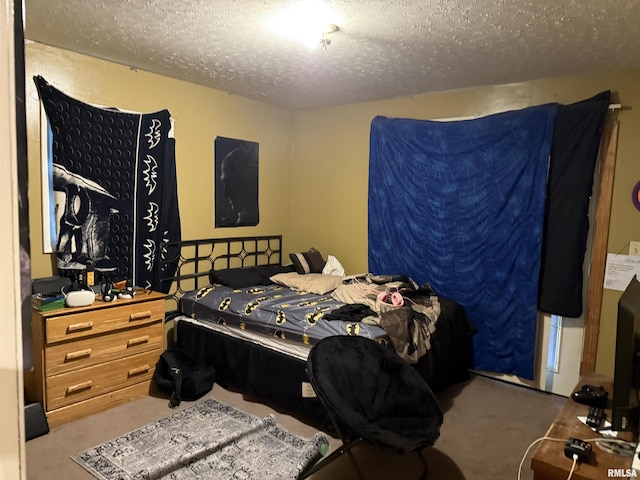 carpeted bedroom with a textured ceiling