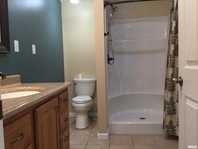 bathroom with vanity, curtained shower, tile patterned floors, and toilet