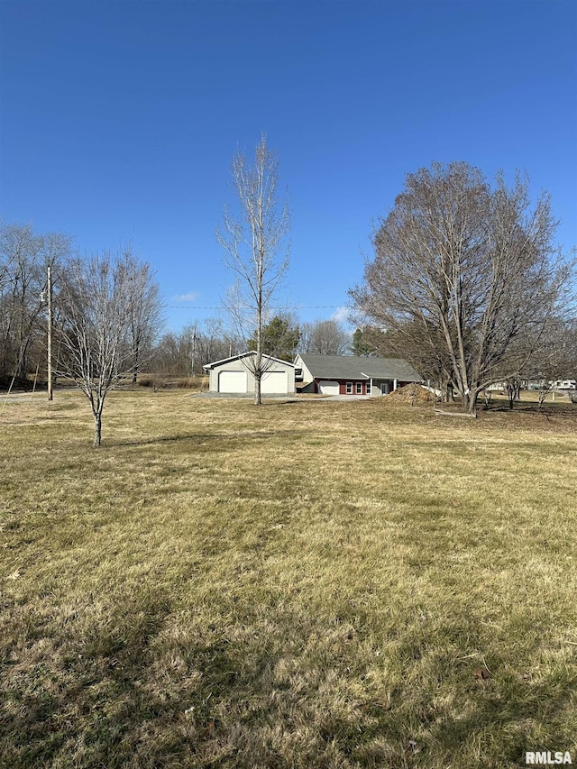 view of yard with a rural view