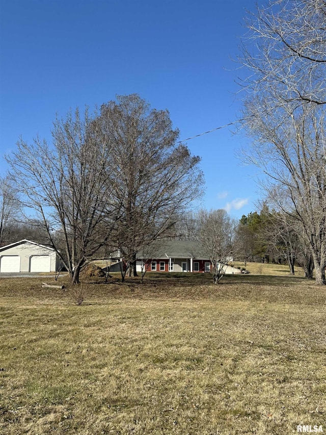 view of yard featuring a garage