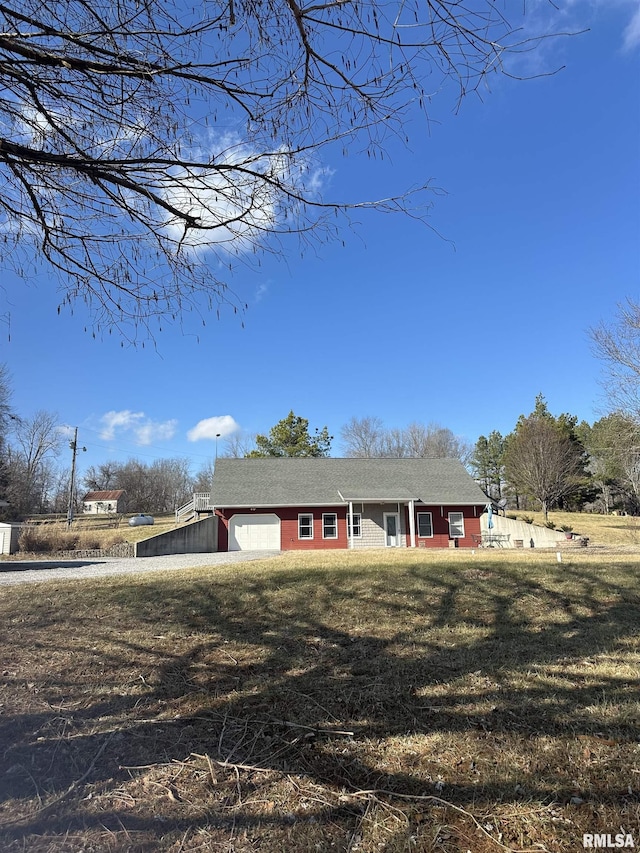 ranch-style house with a front lawn